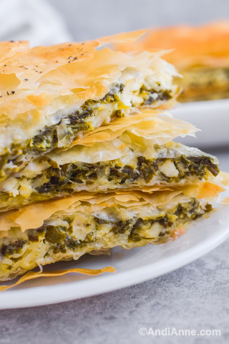 Spinach feta pie stacked on top of eachother.