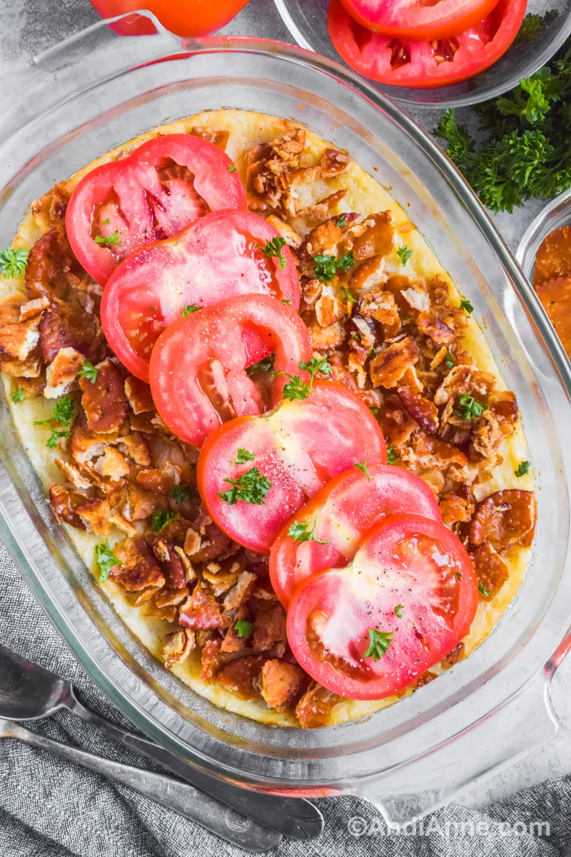 mashed turnip casserole with crunchy cracker topping and fresh tomato slices.