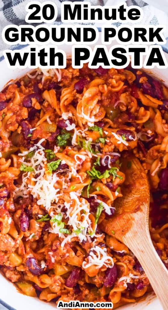a pot of 20 minute ground pork with pasta recipe with a wood spoon