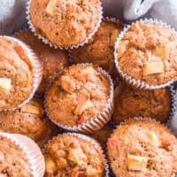 Overhead view of muffins on a hand towel.