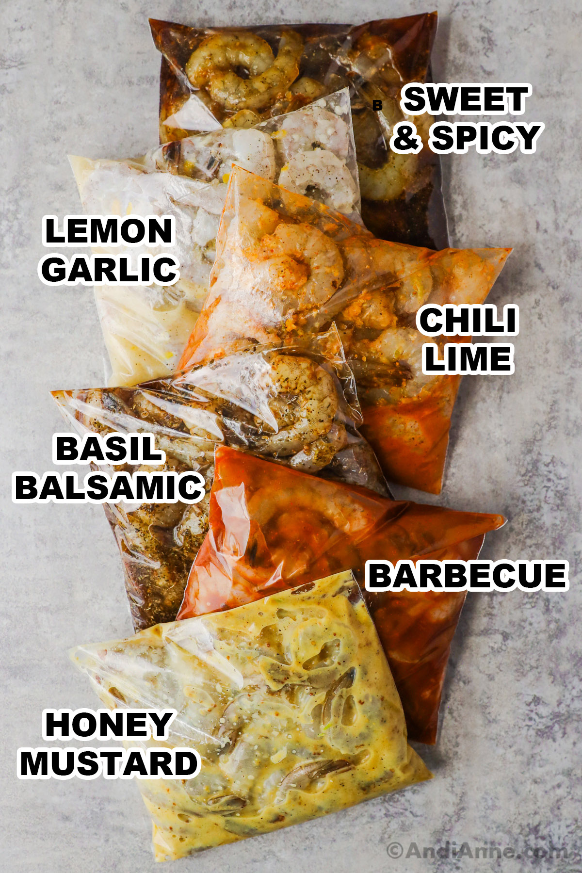 Six bags of raw shrimp with different sauces inside each including sweet and spicy marinade, lemon garlic, chili lime, basil balsamic, barbecue, and honey mustard.