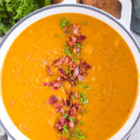 Overhead view of bacon squash soup in a pot.