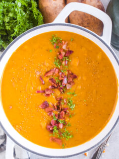 Overhead view of bacon squash soup in a pot.