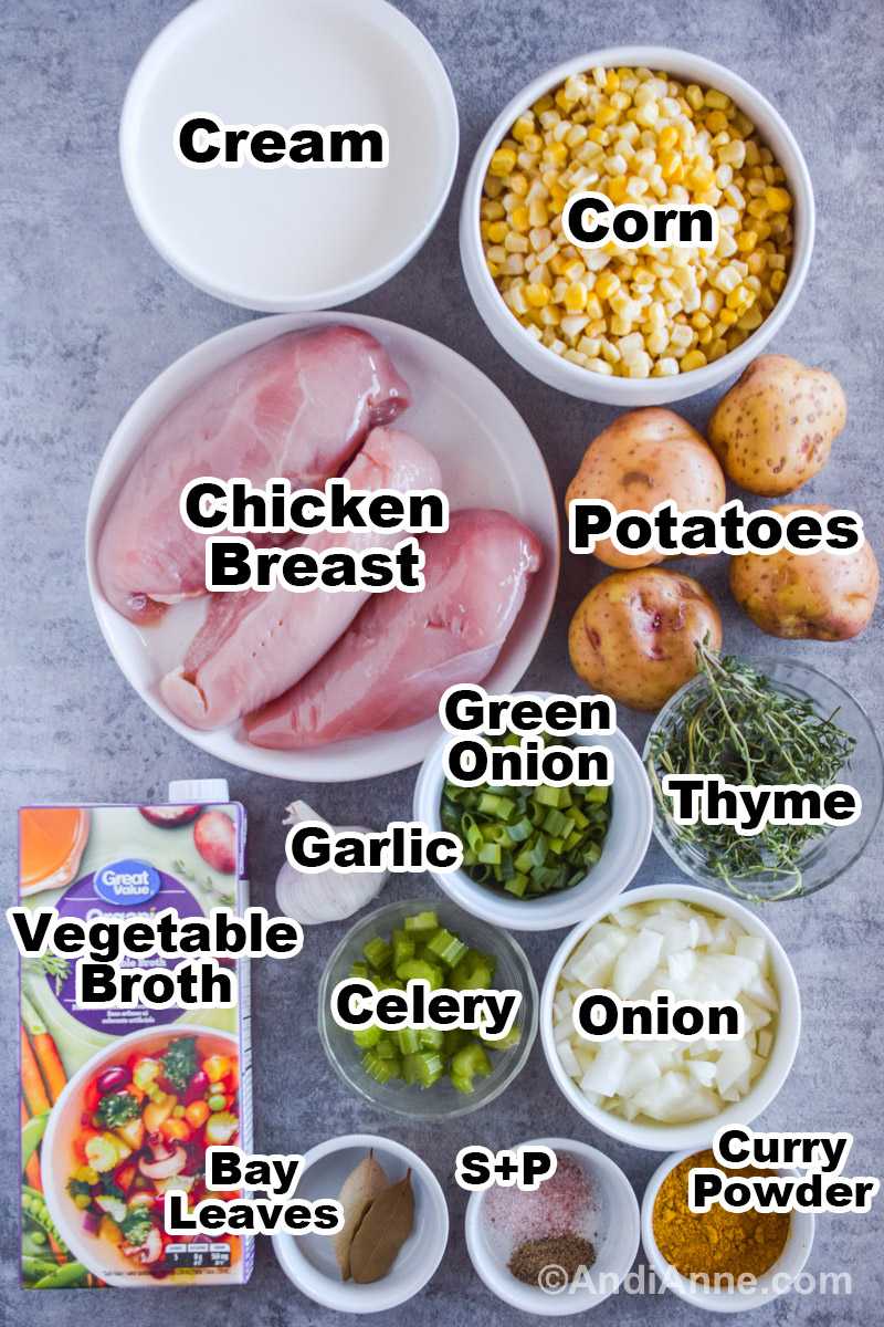 Recipe ingredients on the counter including bowls of cream, corn, chicken breasts, potatoes, green onion, celery, and container of vegetable broth.