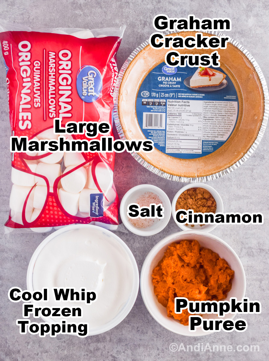 Recipe ingredients on the counter including a bag of marshmallows, graham cracker crust, cool whip, pumpkin puree, salt and pumpkin pie spice.