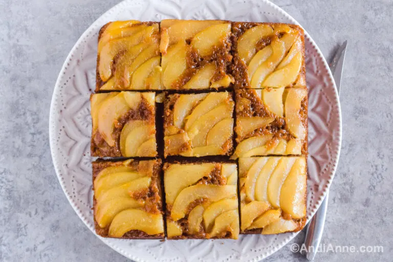Upside down pear gingerbread cake sliced into 9 squares.