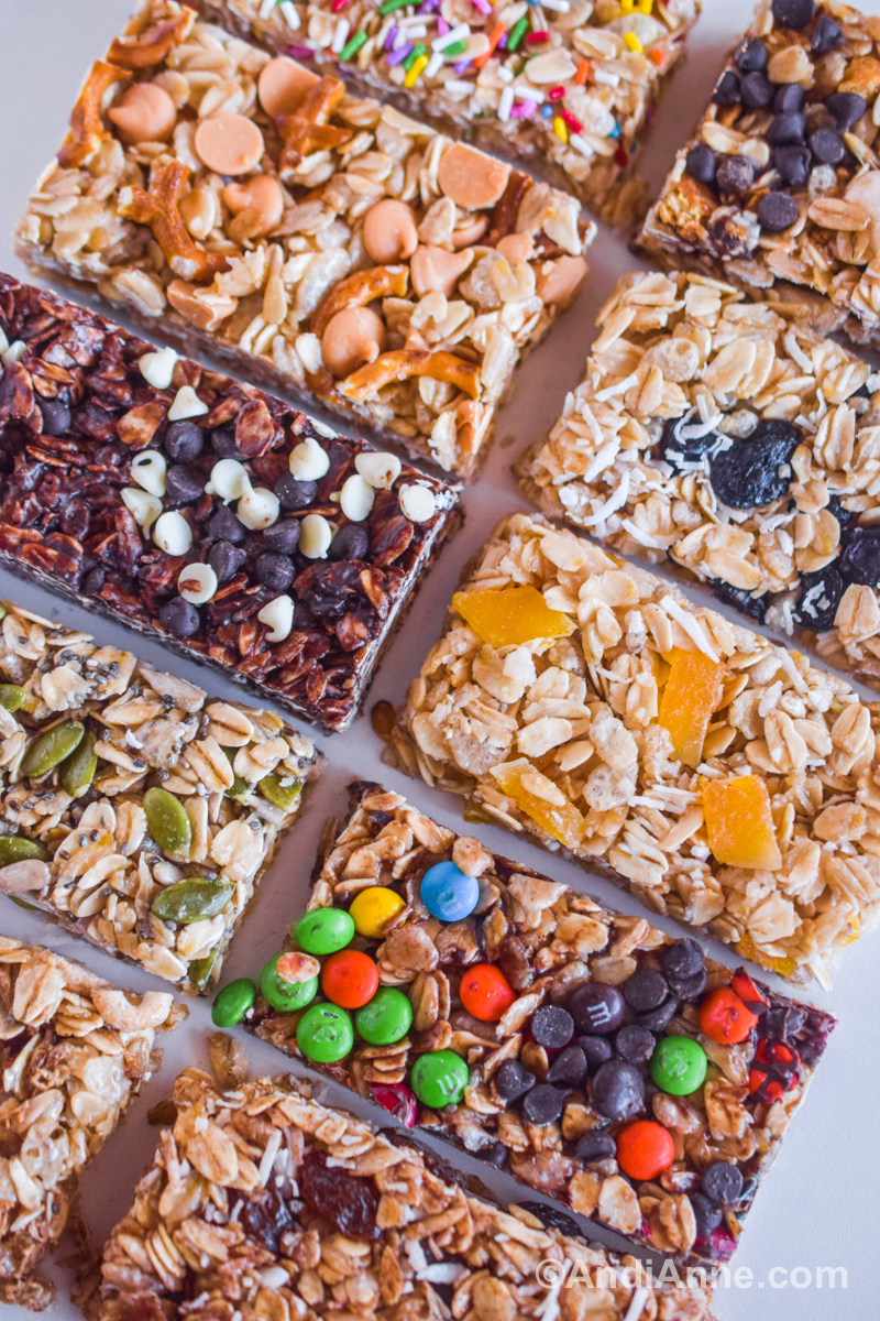 Close up of various granola bar flavors all stacked together.