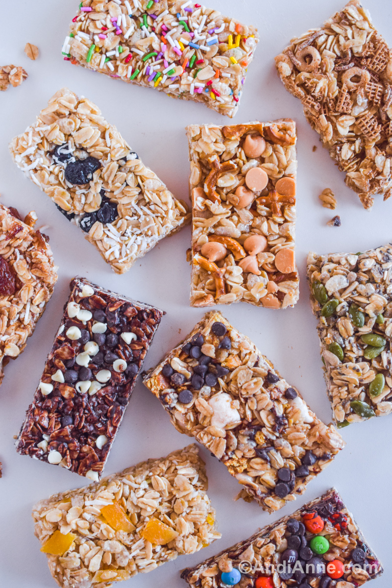Granola bars in various flavors on a white counter.