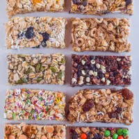 Various different granola bars on a white surface.