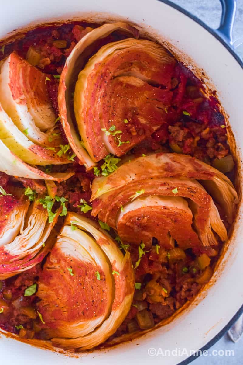 Close up of baked cabbage wedges with ground beef mixture on top.