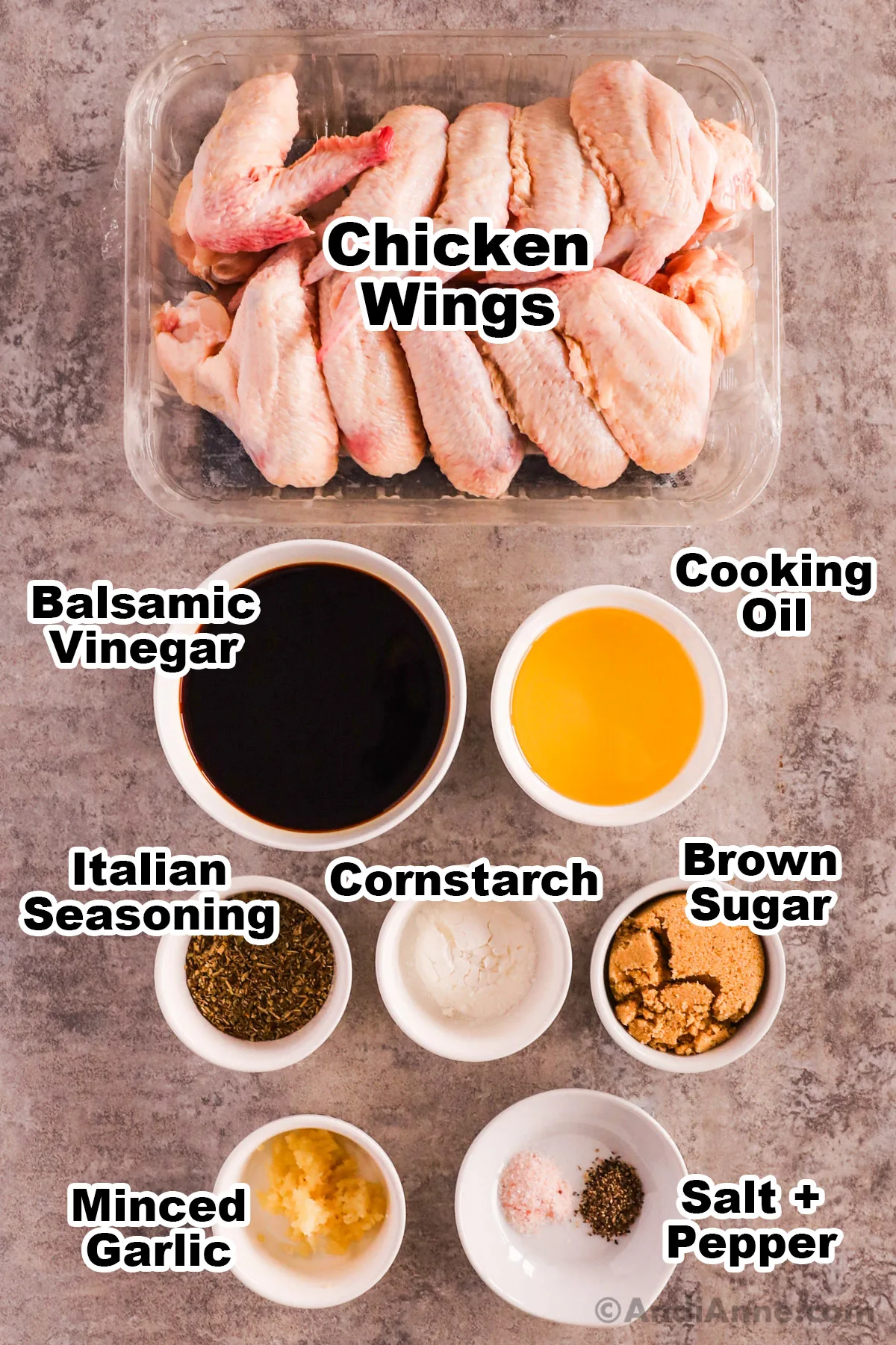 Recipe ingredients including raw chicken wings, bowls of balsamic vinegar, cooking oil, cornstarch, brown sugar, minced garlic and spices.