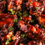 Close up of saucy balsamic glazed chicken wings
