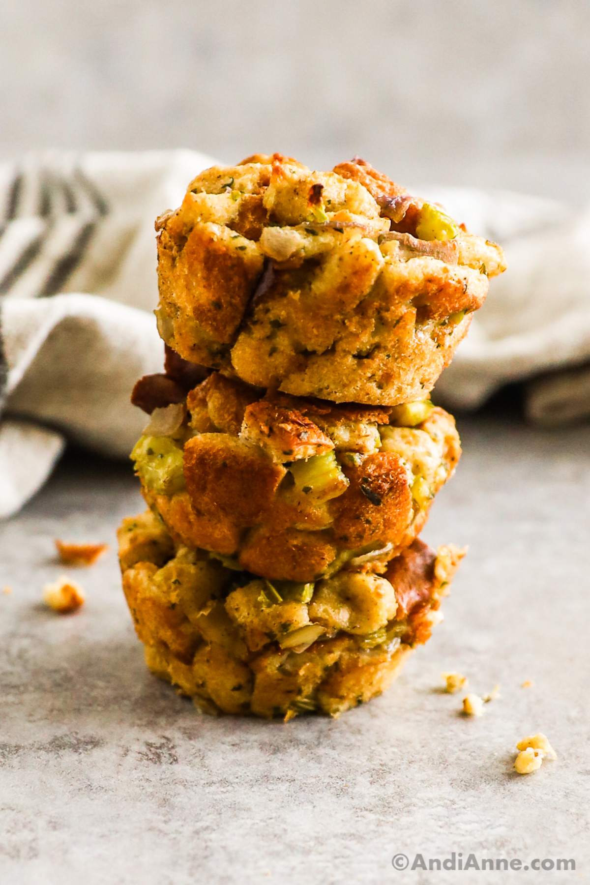 Three stuffing muffins stacked on top of eachother.