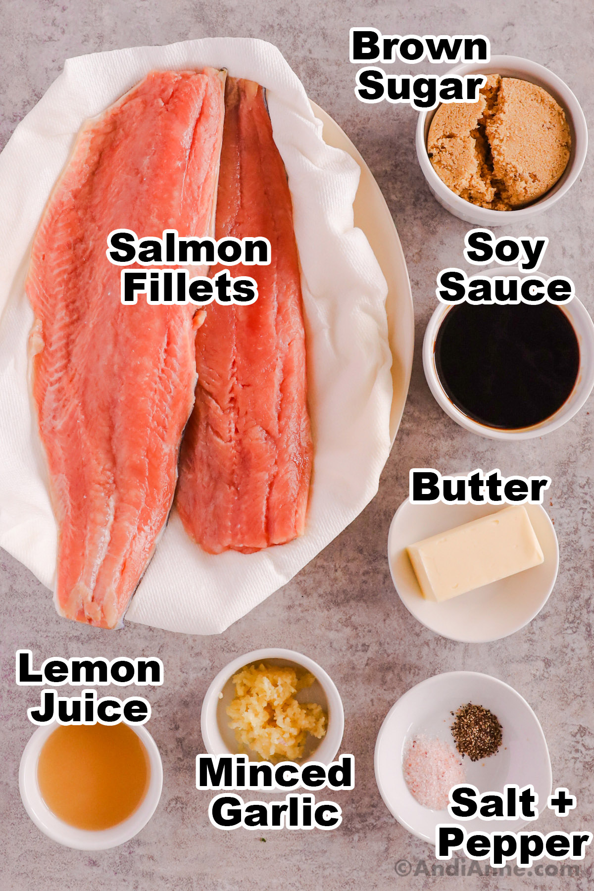 Recipe ingredients including raw salmon fillets, bowl of brown sugar, soy sauce, butter, lemon juice, minced garlic, salt and pepper.