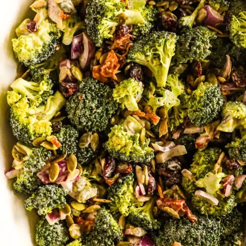 Broccoli crunch salad in a white bowl.
