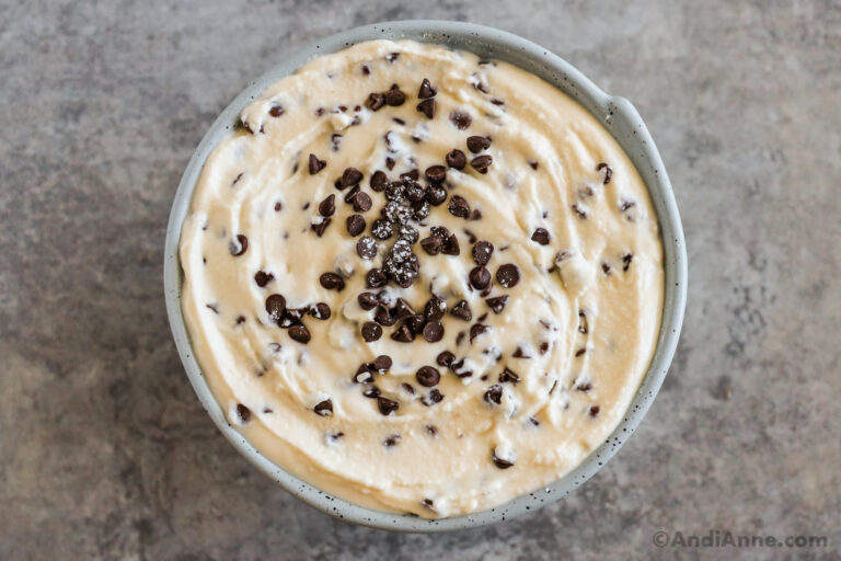 A bowl of cannoli dip topped with mini chocolate chips.