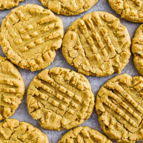 Peanut butter cookies side by side on the counter.