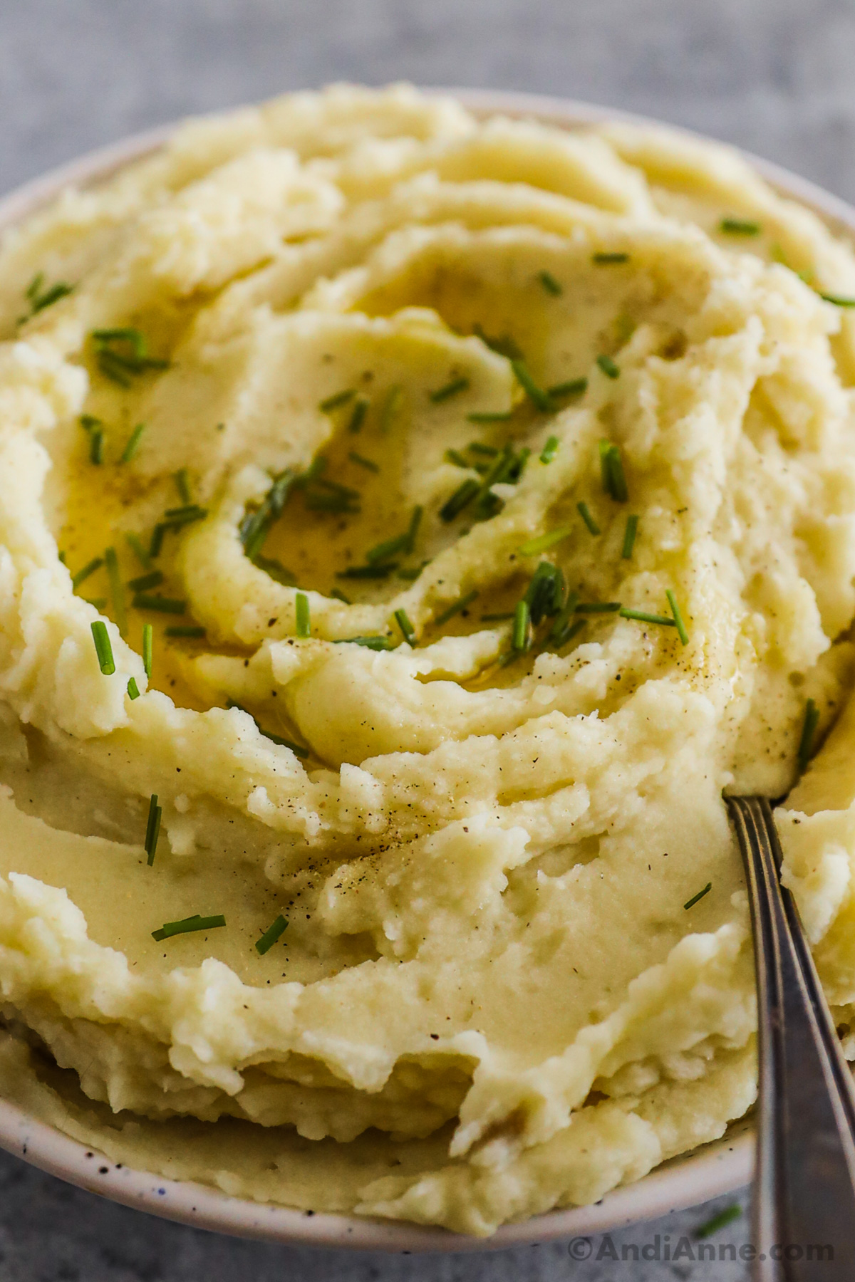 Close up of plant based mashed potatoes with chives on top. 