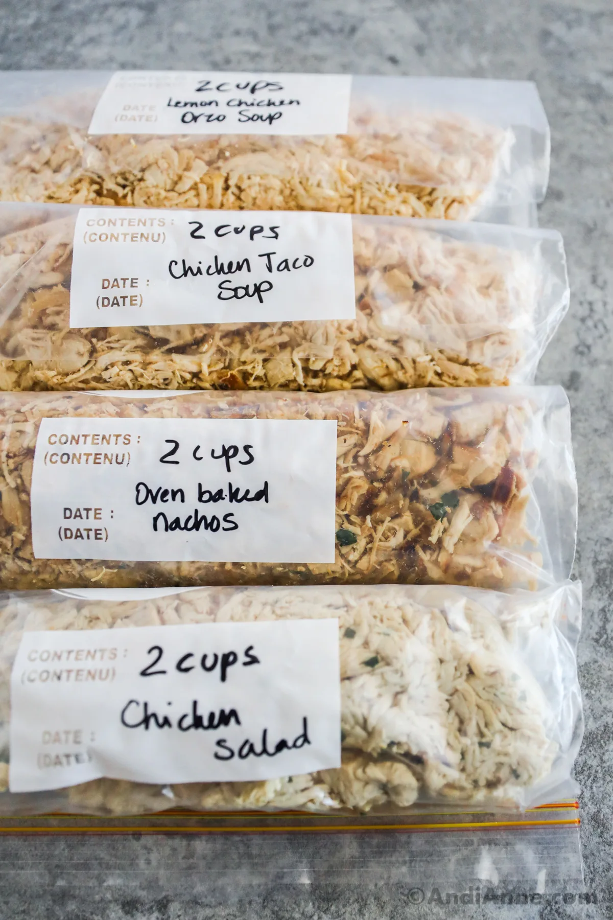 Freezer bags with shredded chicken inside.
