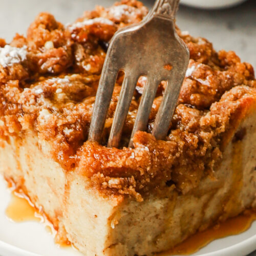 fork digging into a slice of french toast bake