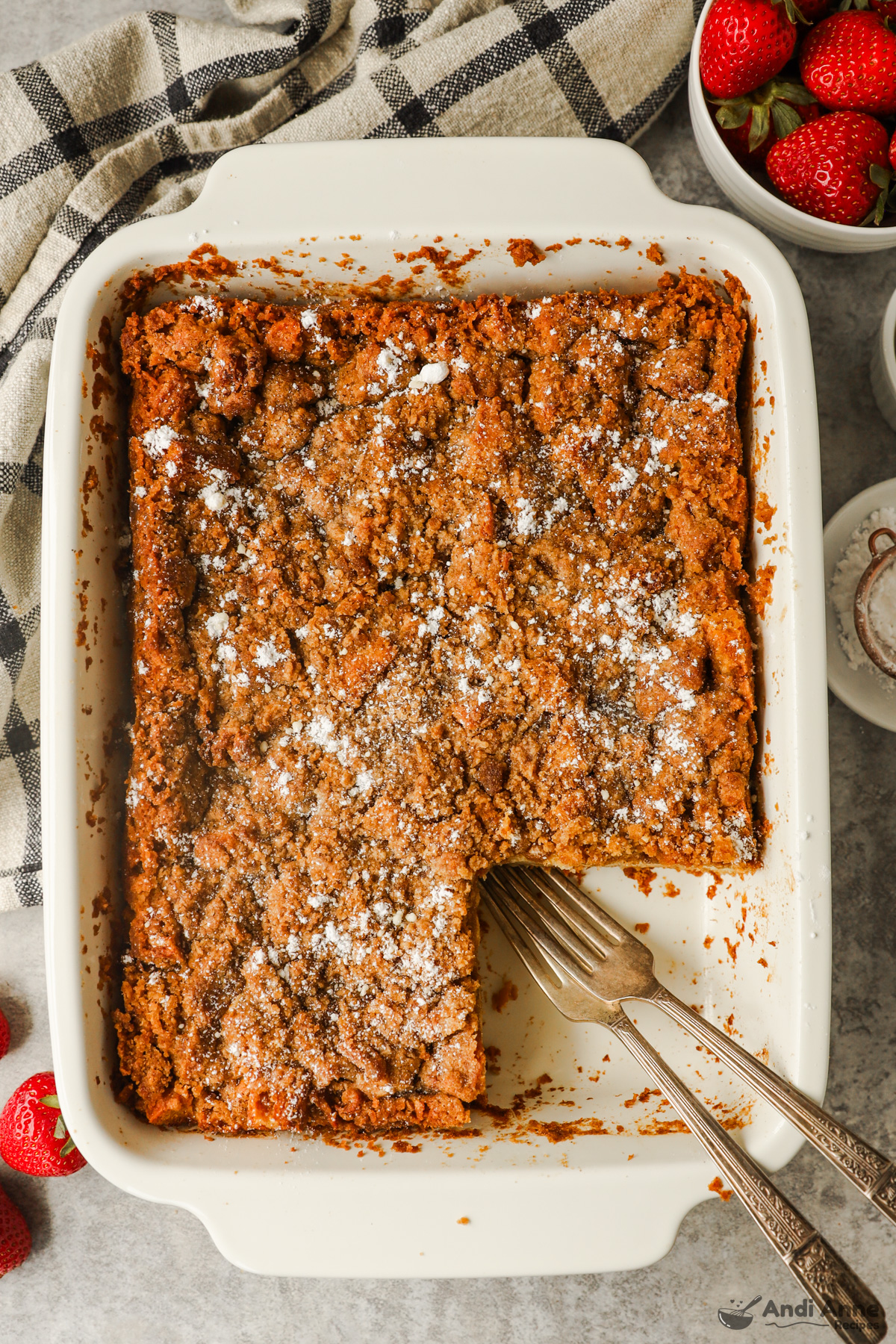 White casserole dish with french toast bake recipe inside.