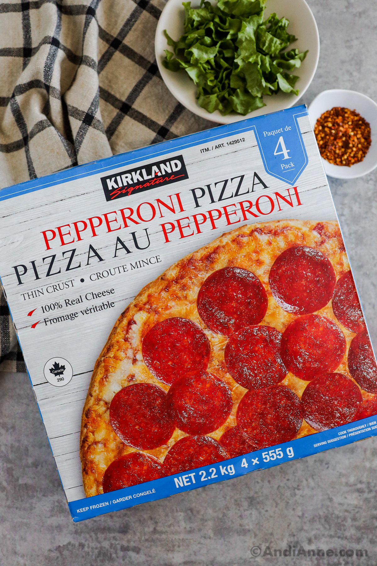 A box of kirkland signature pepperoni pizza.