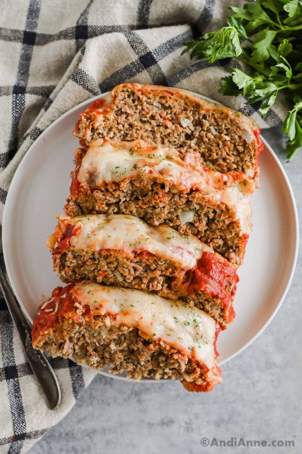 Slices of italian meatloaf on a plate.