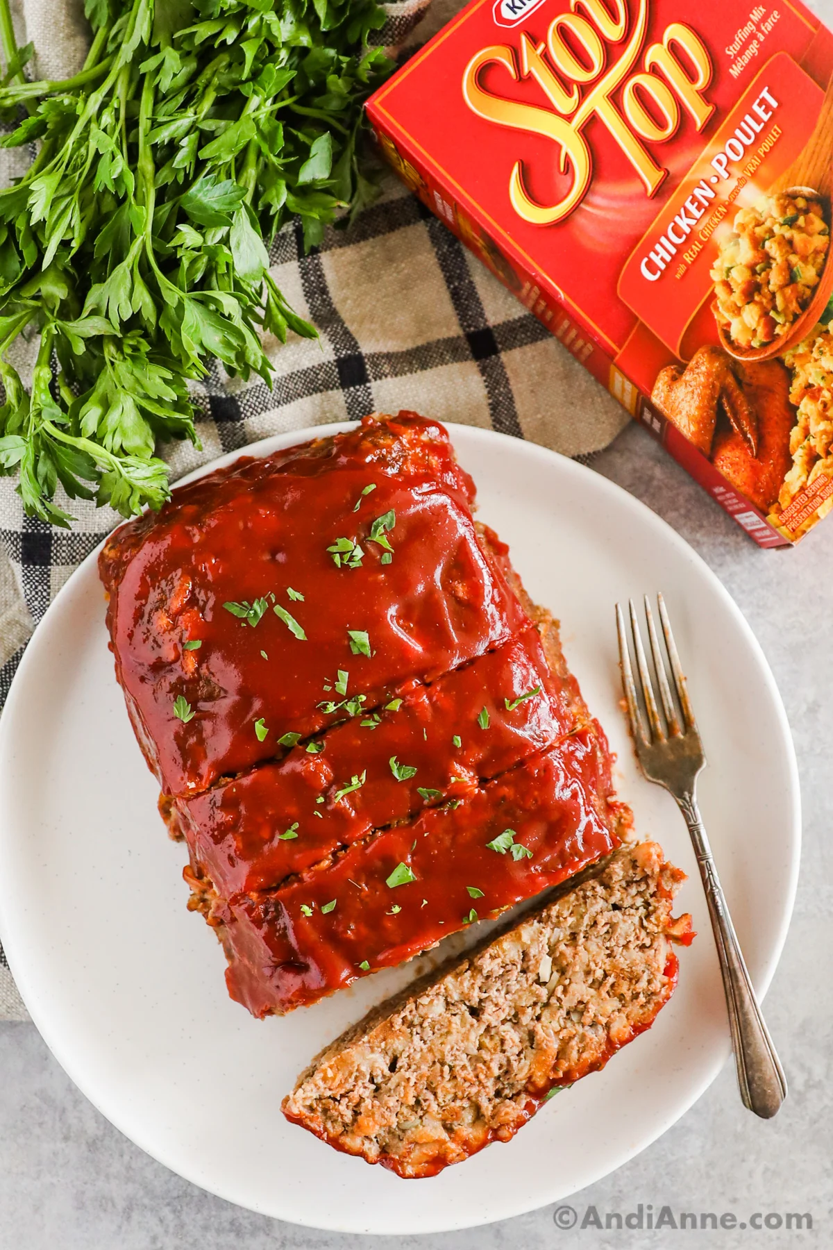 Stove top stuffing meatloaf with box of stove top and parsley in the background.