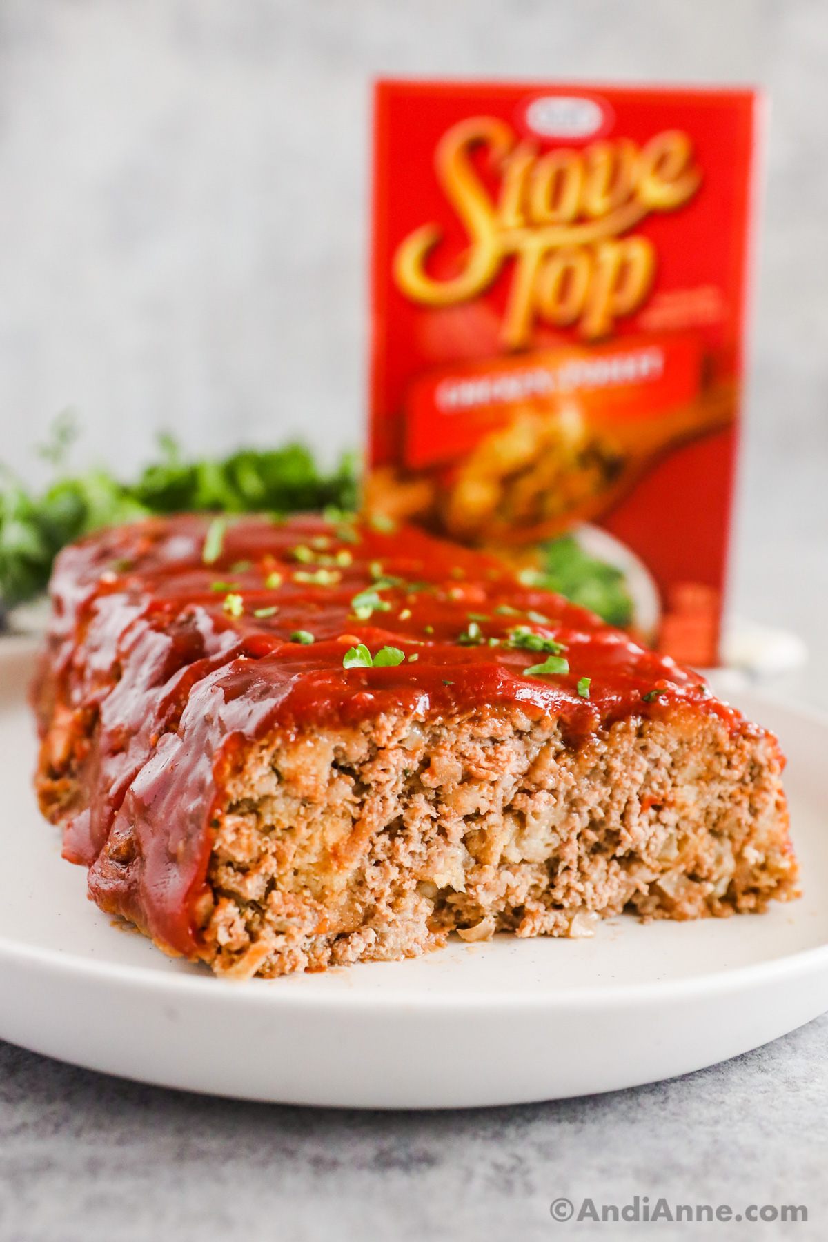 Close up of stove top stuffing meatloaf with box of meatloaf in background.
