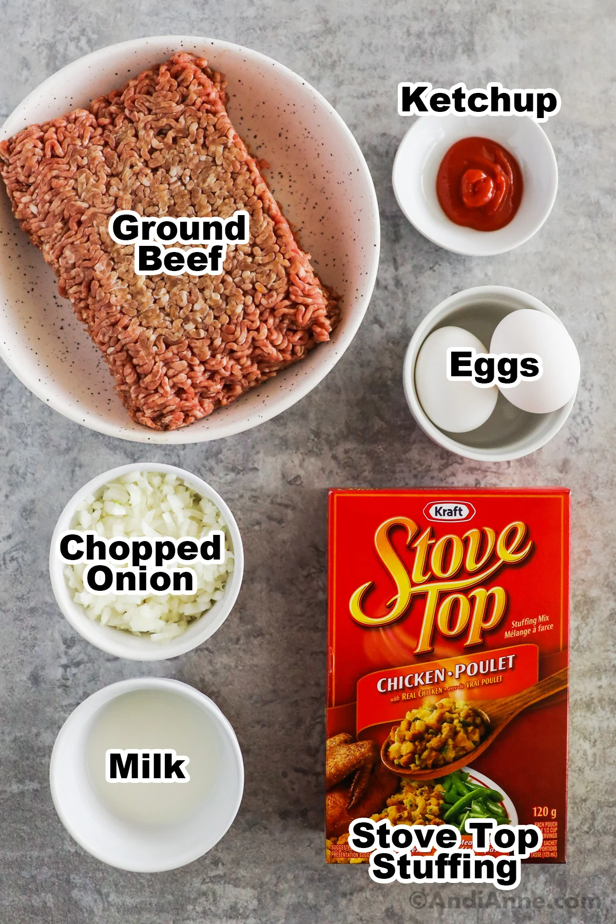 Recipe ingredients including box of stove top stuffing, raw ground beef on plate, and bowls with eggs, ketchup, chopped onion and milk.