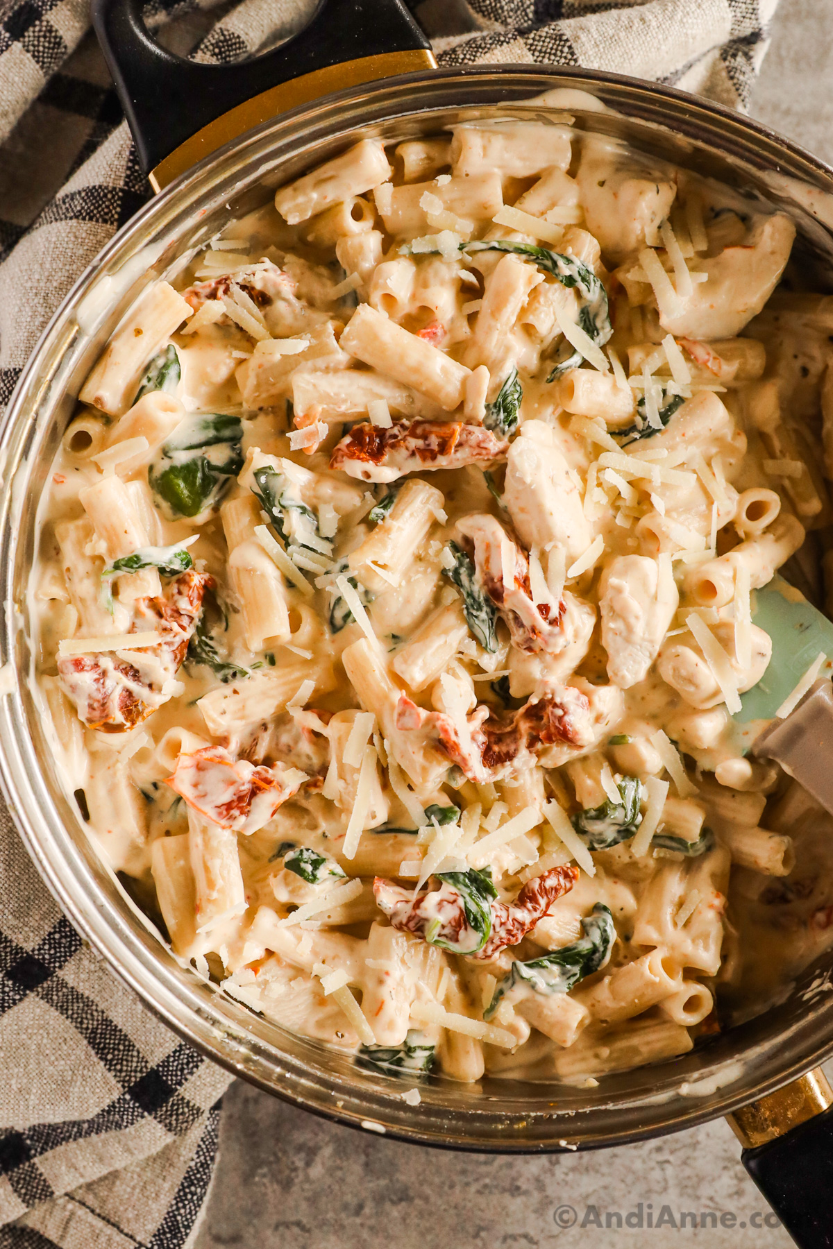Close up of creamy tuscan chicken pasta in a pot.