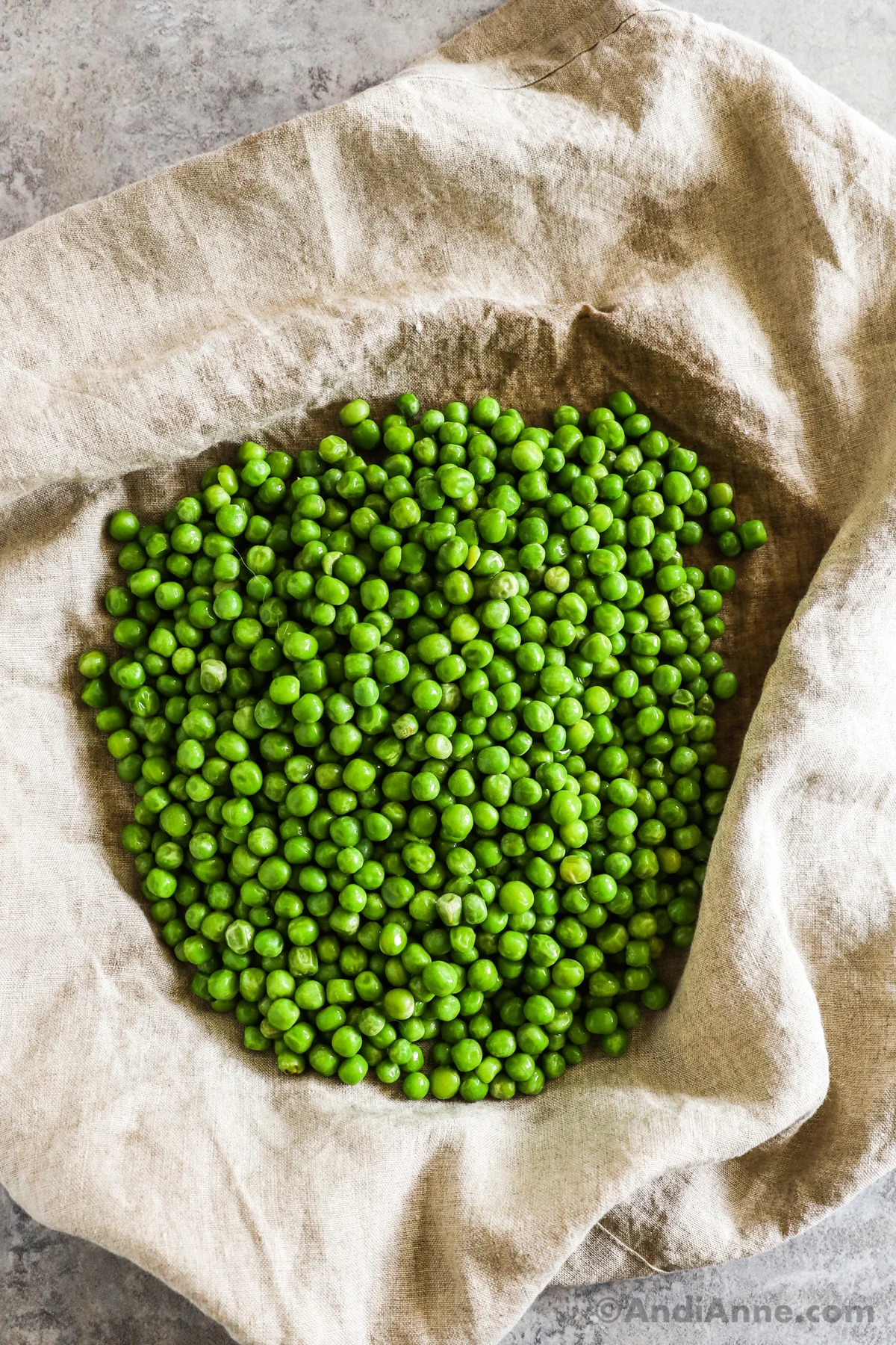 Peas on a kitchen towel.