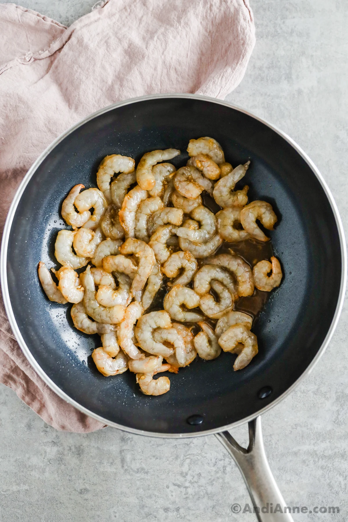 Raw shrimp in a frying pan. 