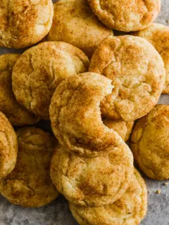 Snickerdoodle cookies piled on top of eachother.