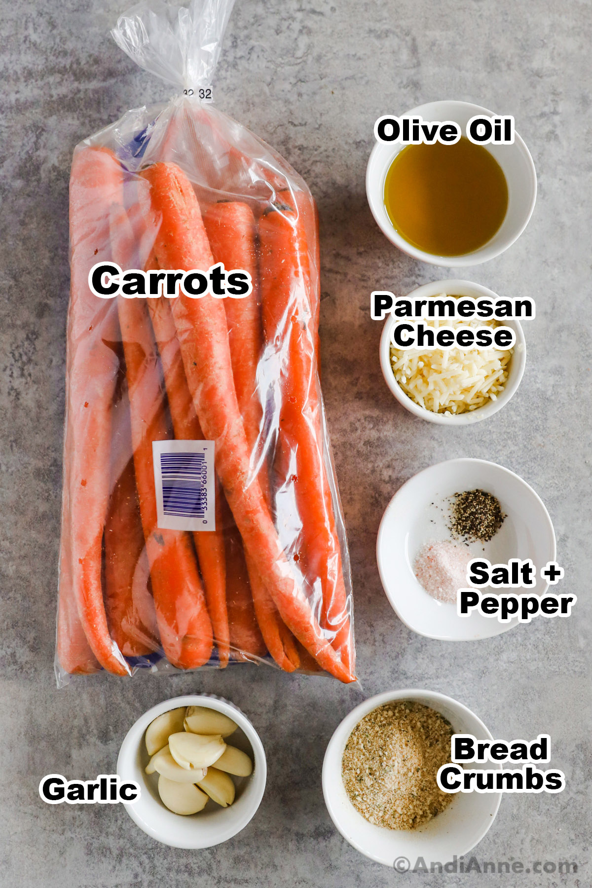 Recipe ingredients including a bag of carrots, bowl of olive oil, grated parmesan cheese, salt and pepper, garlic cloves, and bread crumbs.