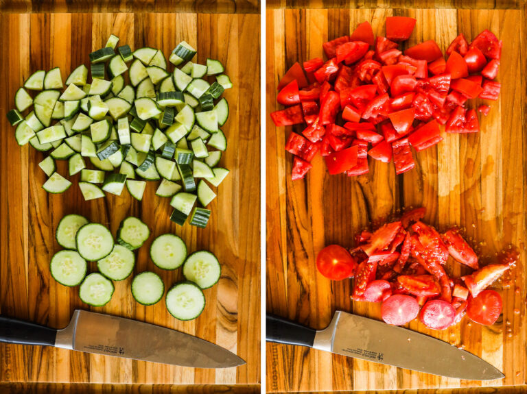 Chopped cucumber and chopped tomato with a knife on a cutting board.