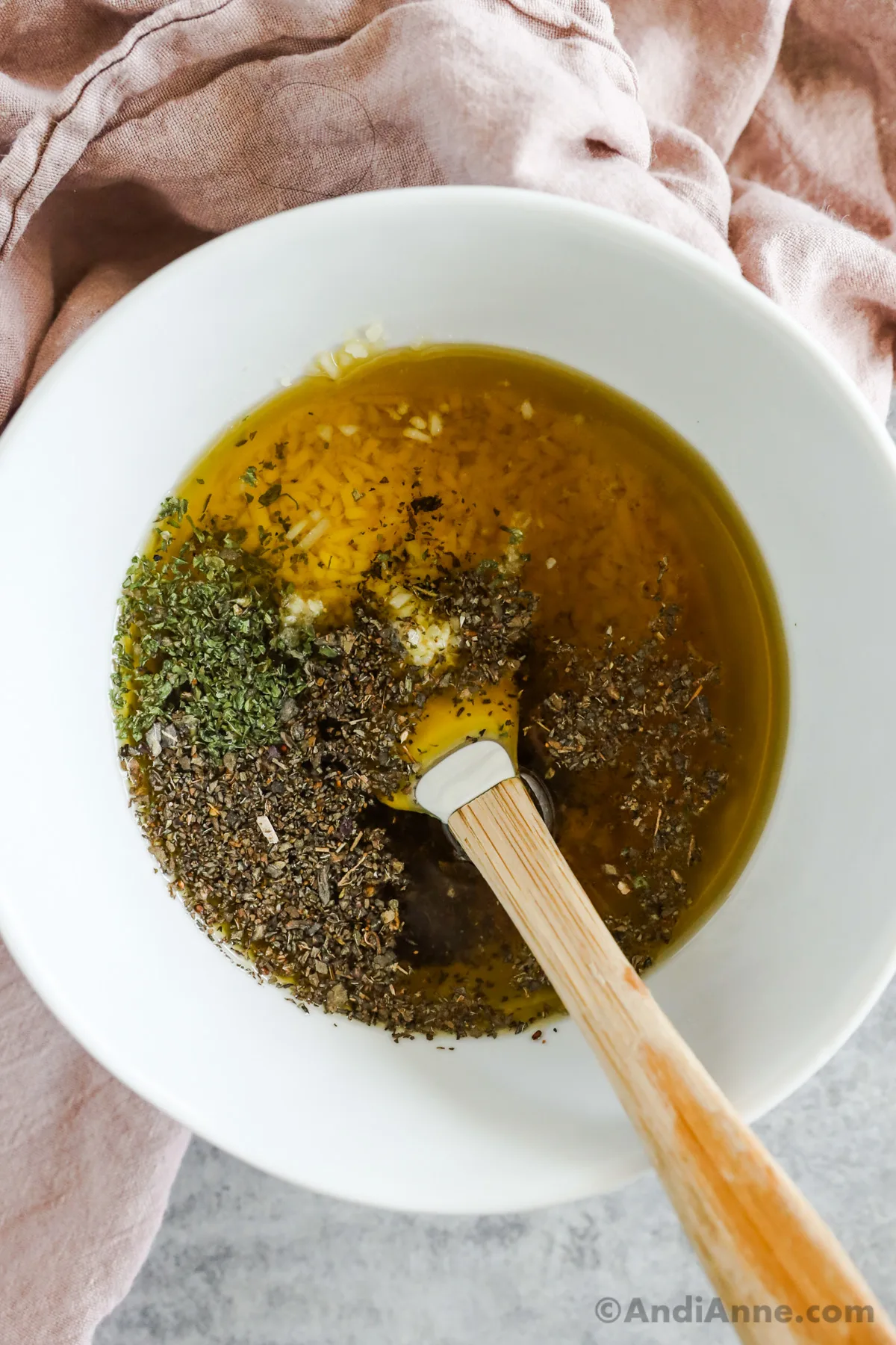 Ingredients in a bowl to make Italian salad dressing recipe.