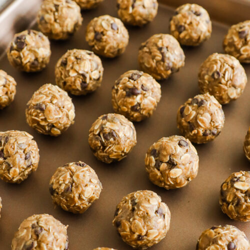 Peanut butter oat balls on a baking sheet.