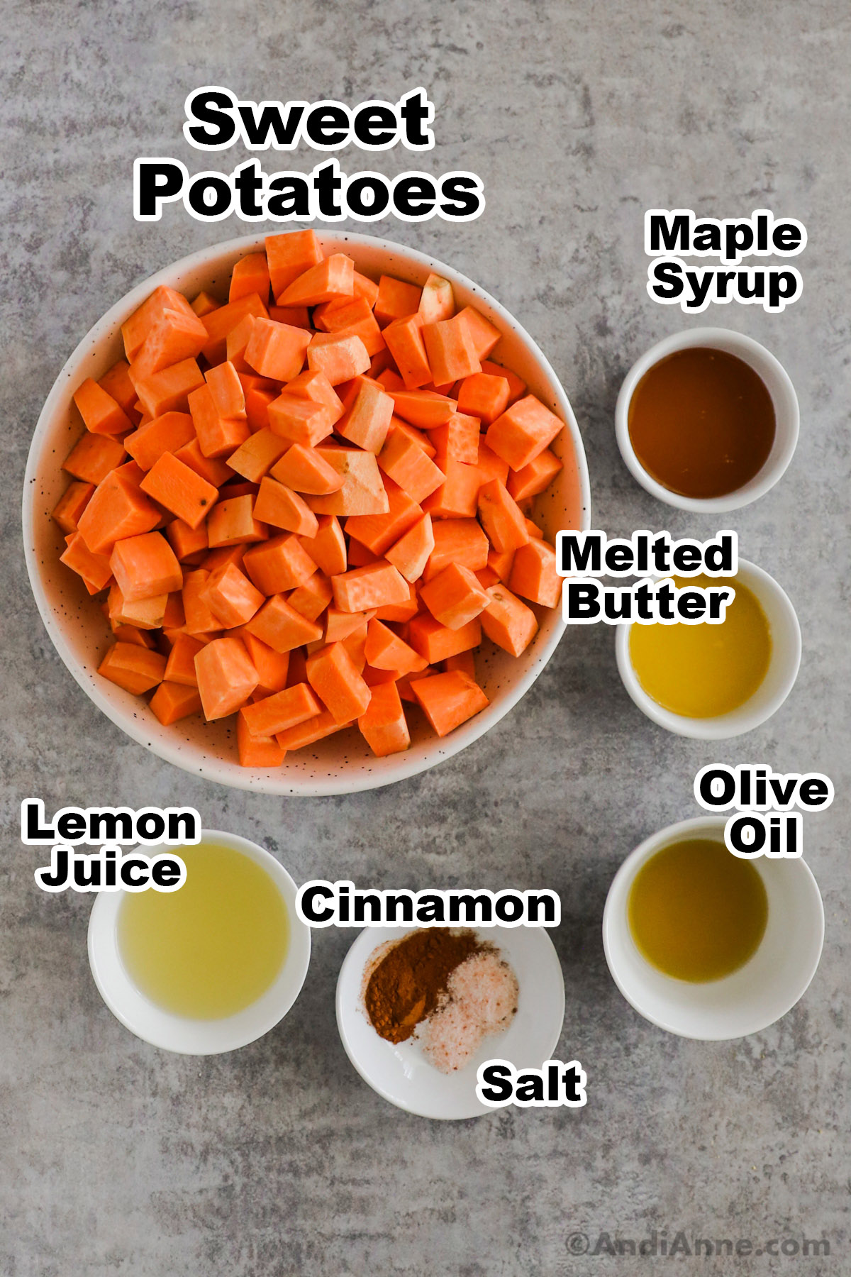 Recipe ingredients in bowls including chopped sweet potato, maple syrup, melted butter, olive oil, lemon juice, cinnamon and salt.