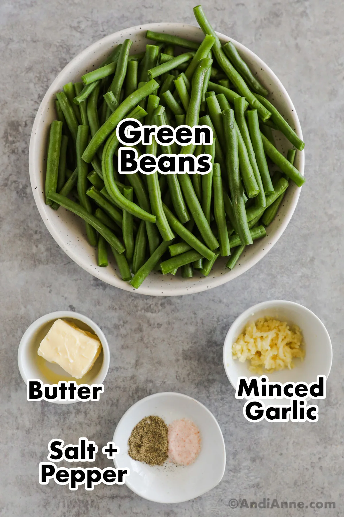 Bowls of chopped green beans, butter, minced garlic, salt and pepper.