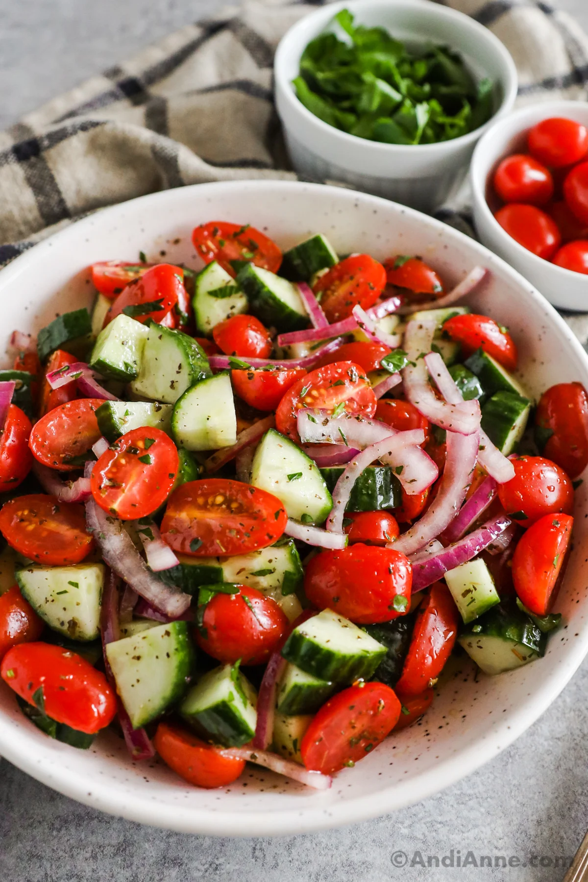 Tomato cucumber salad tossed with a greek dressing.
