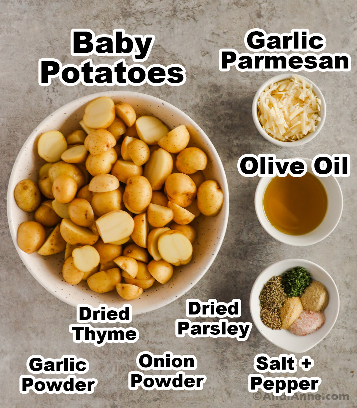 Recipe ingredients in bowls including sliced baby potatoes, grated parmesan, olive oil, and spices.