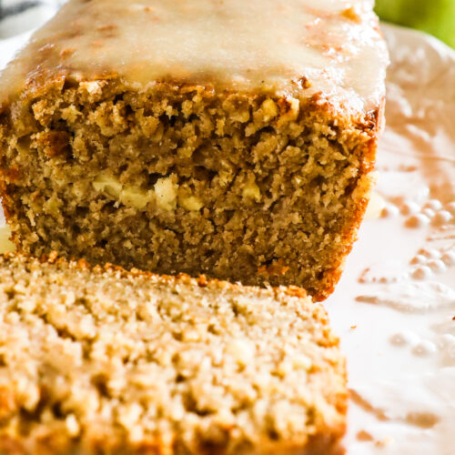 apple cinnamon oatmeal loaf topped with applesauce frosting.