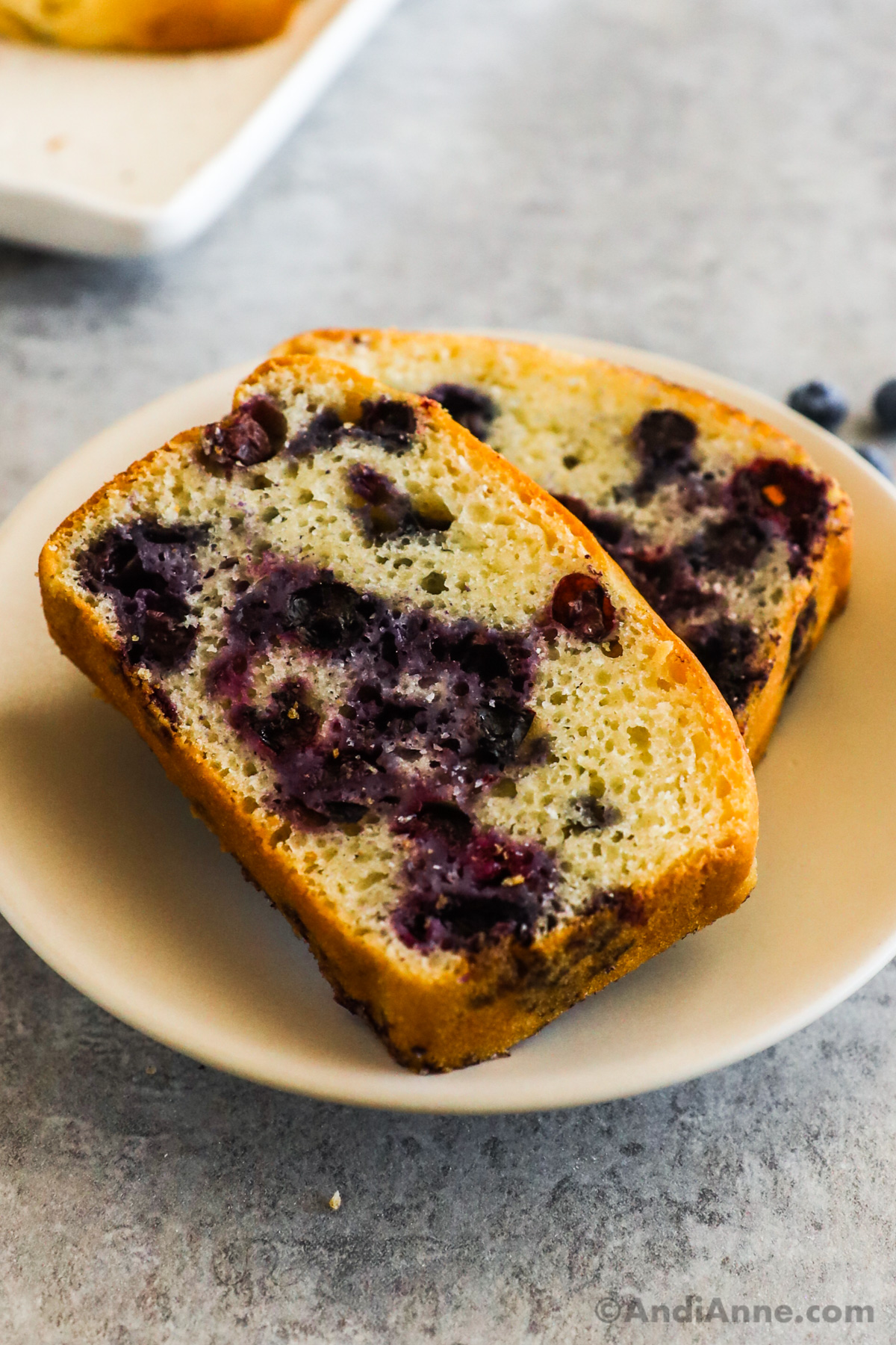 Two slices of blueberry loaf.
