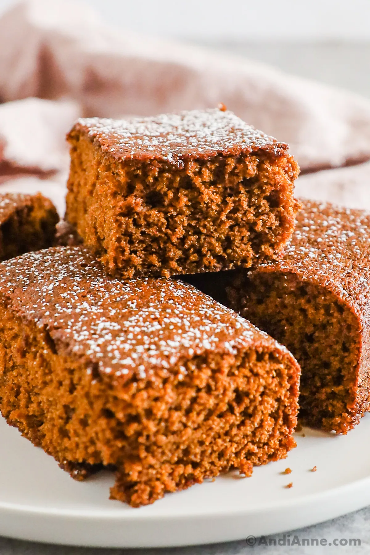 Slices of gingerbread cake stacked on top of eachother.