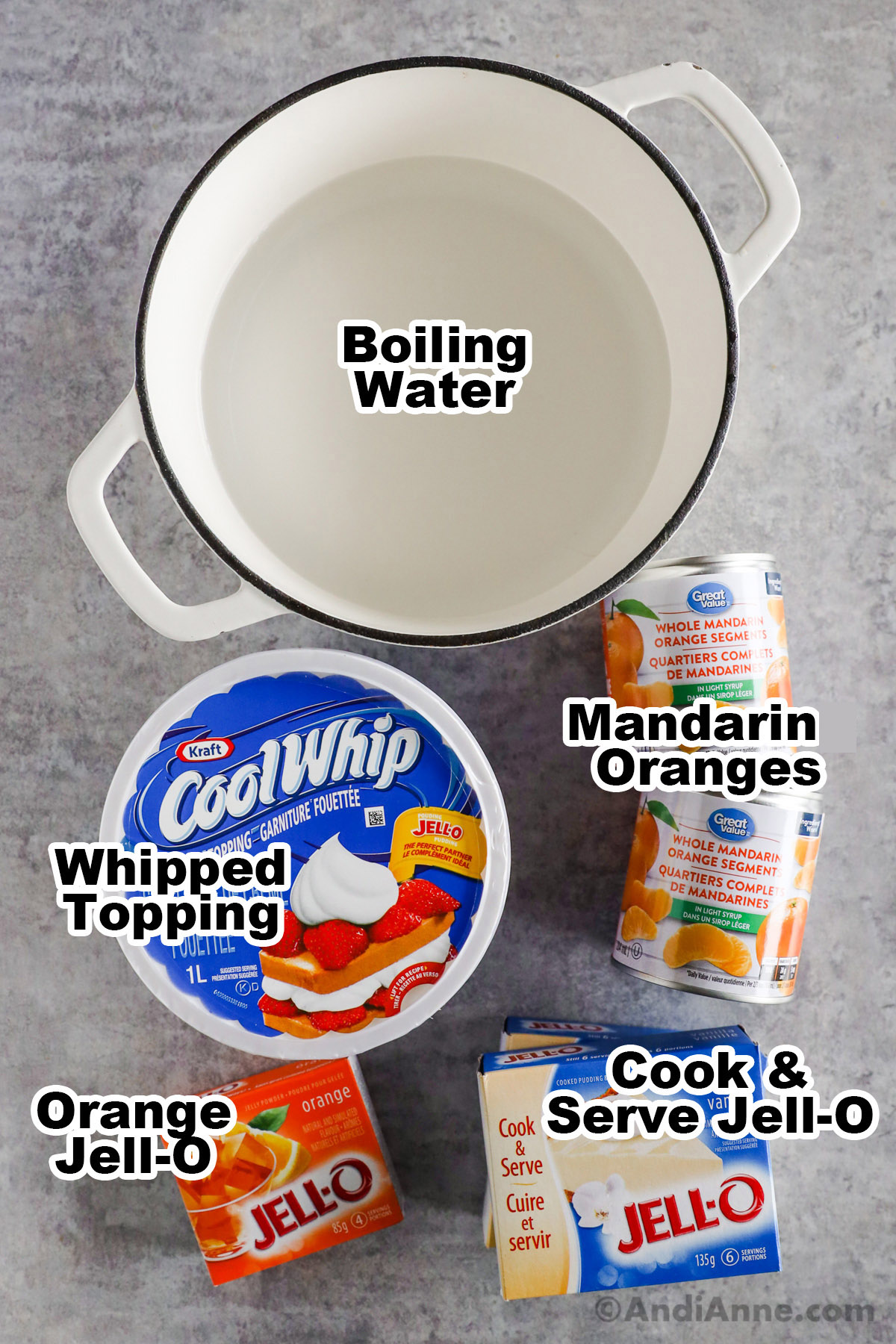 a pot of water, two cans of mandarin oranges, whipped topping carton, vanilla cook and serve jello boxes and orange jello box.
