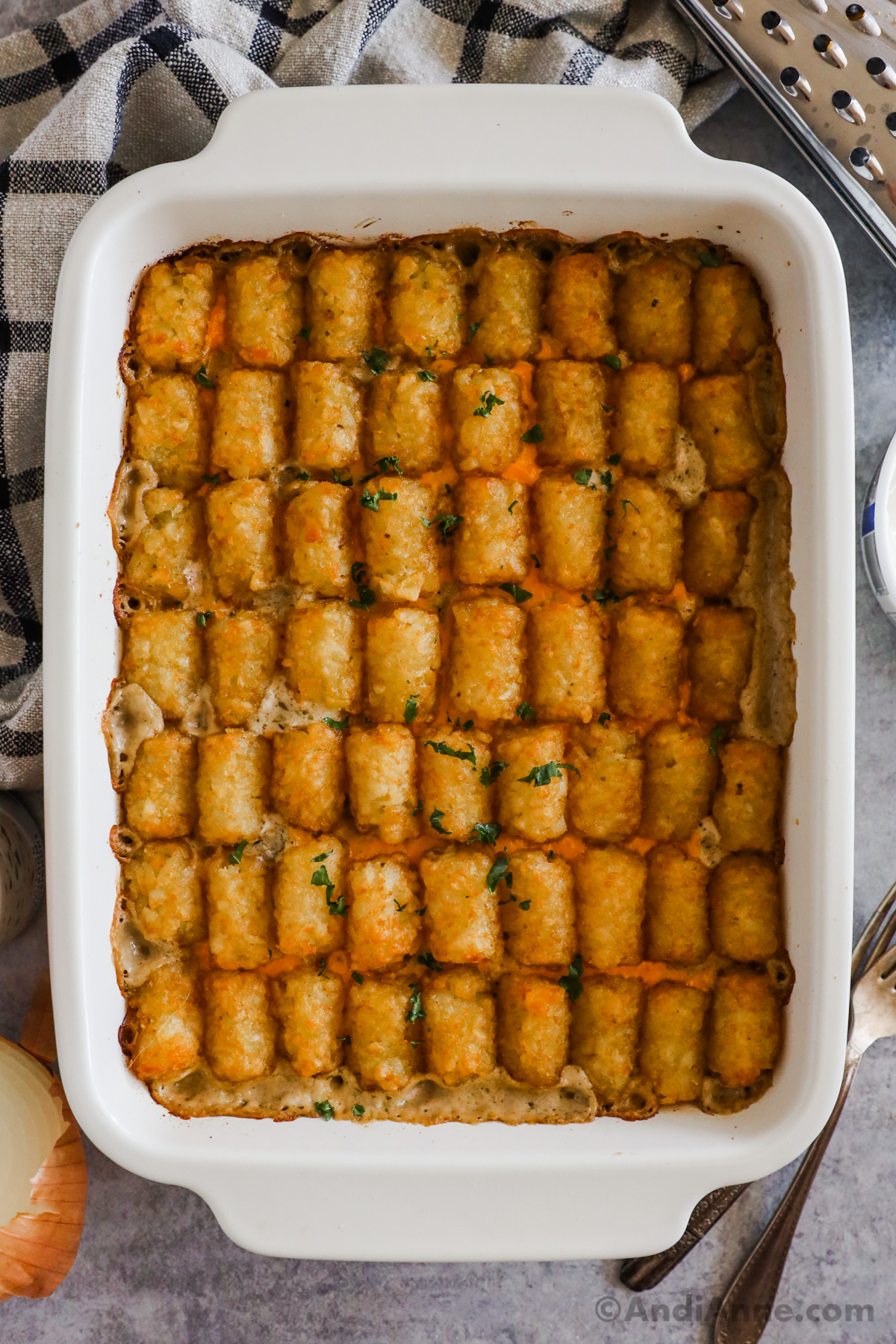 overhead view of baked Tater Tot Casserole in white rectangular baking dish