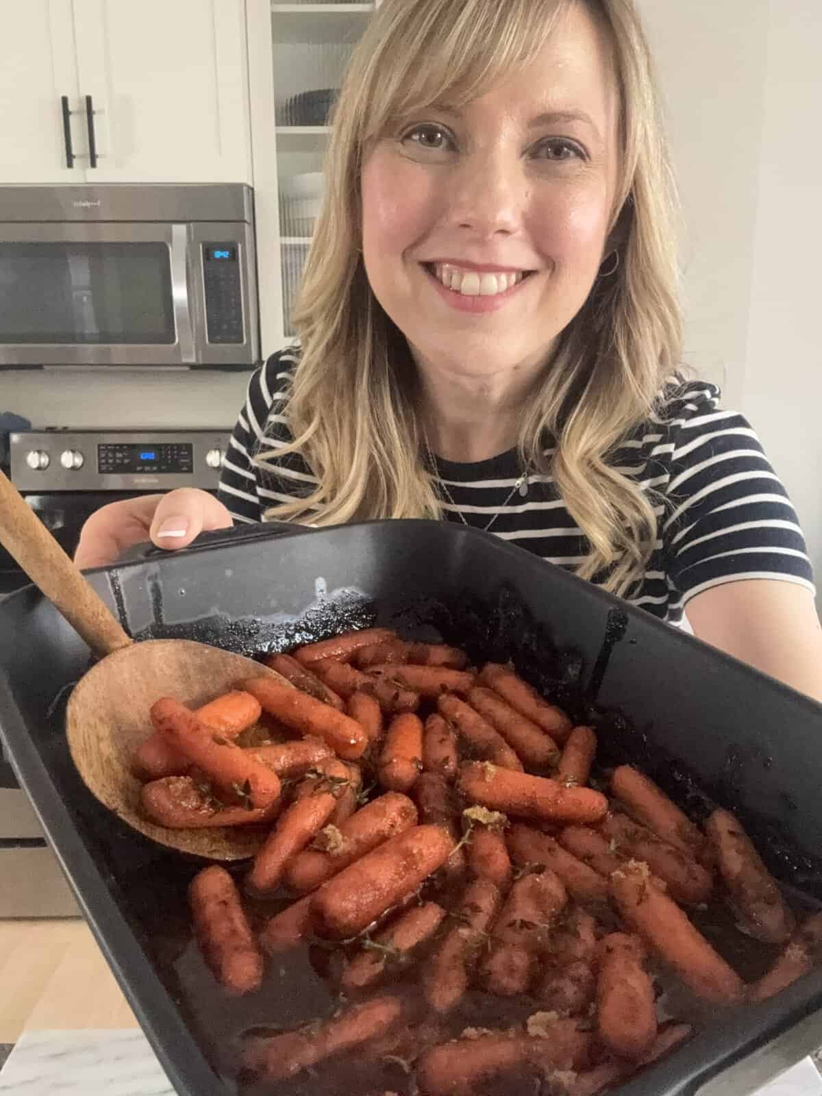 Andi with black dish of brown sugar carrots