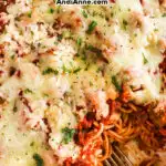 Simple baked spaghetti and meatballs topped with cheese.