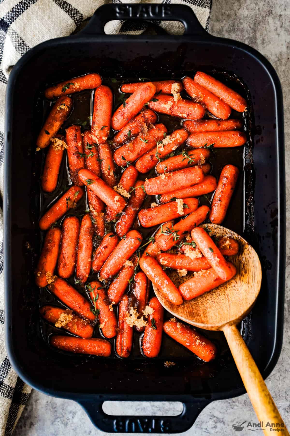 black casserole dish with roasted carrots